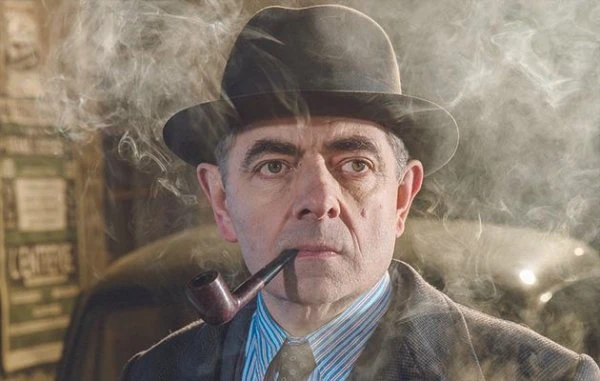 Rowan Atkinson as Maigret